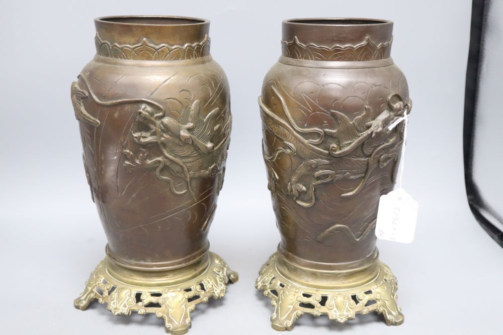 A pair of Japanese bronze vases with French bronze bases